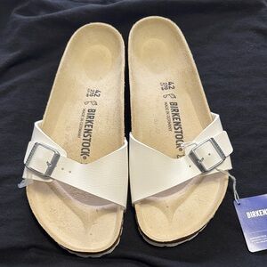 Birkenstock Women's Cream Sandals with Silver Buckle